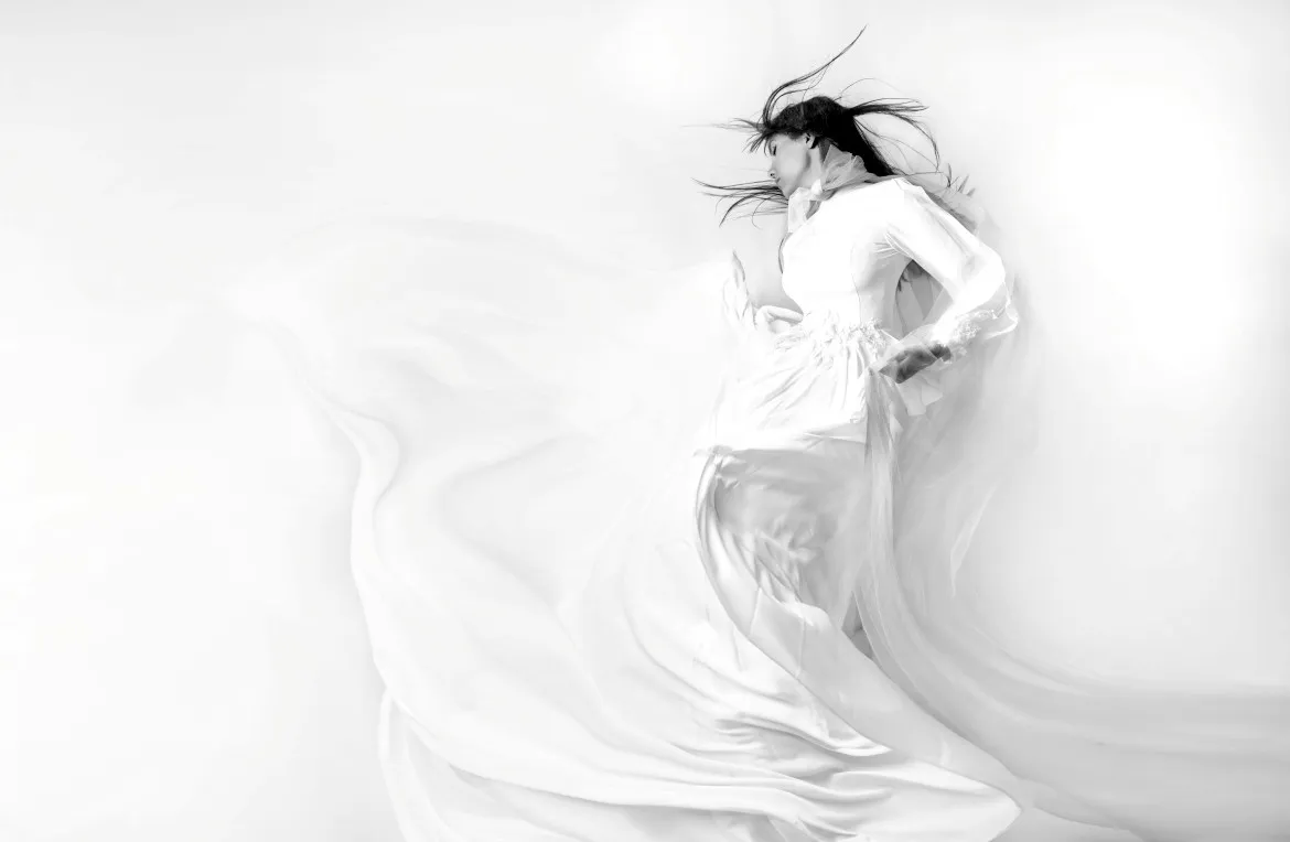Woman in a white dress enjoying an everyday moment